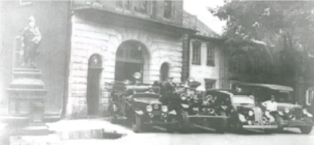 Unidentified unit, 1916 Ahrens-Fox, Buick ambulance, 1927 Dodge ambulance in front of Cumberland Fire Company around 1940